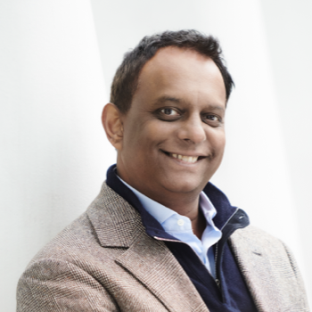 A portrait shot of Nagabhushnam Peddi the CEO of TRUiC