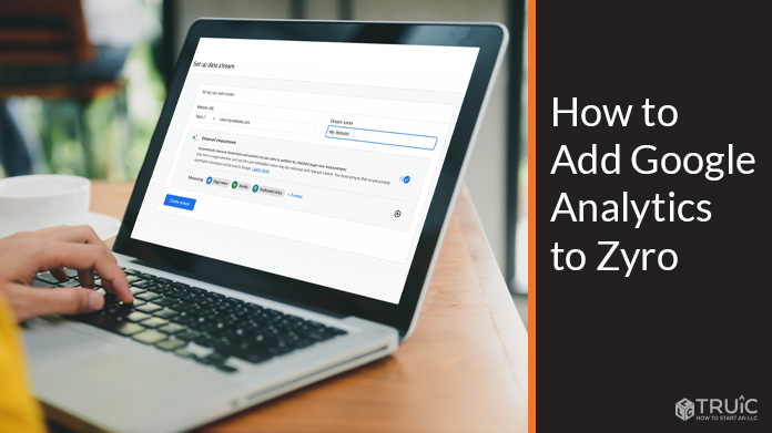 Person adding Google Analytics to Zyro on a laptop.