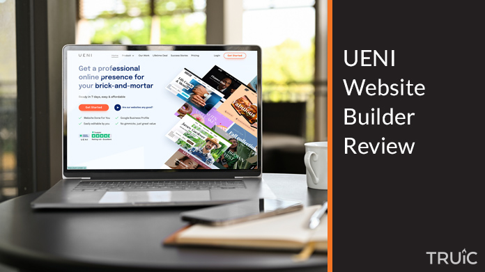 Laptop showing UENI website.