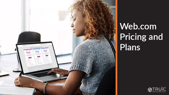 Woman working on computer with Web.com pricing on screen.