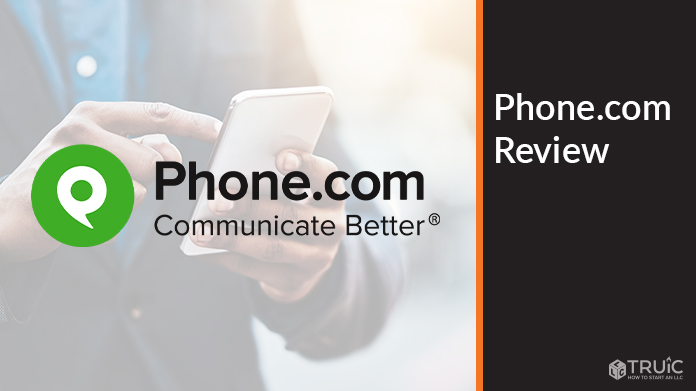 Person on phone looking at a phone.com review.