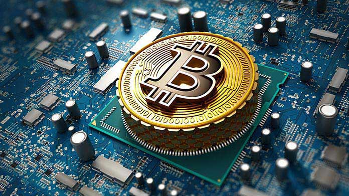 Close up on a stylized bitcoin coin on a keyboard
