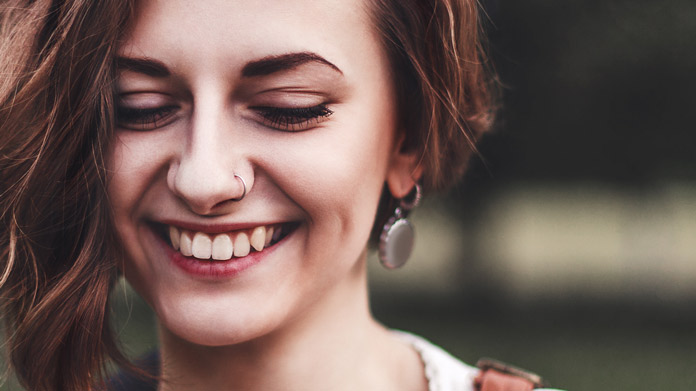 A woman with her ears and nose pierced