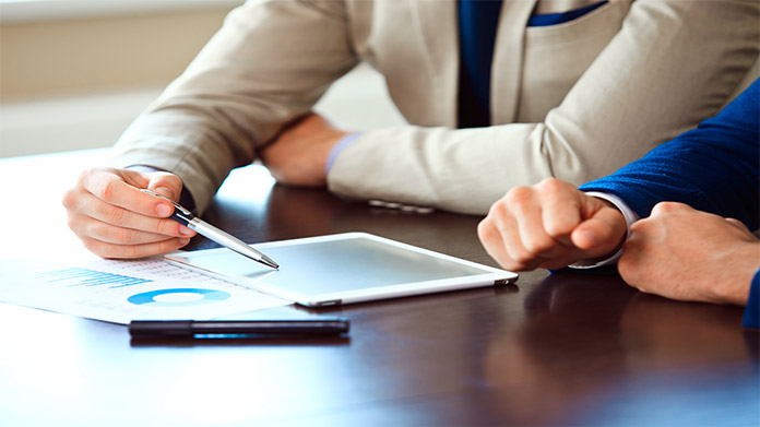 a business consultant giving advice to a business owner