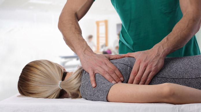 A woman receiving chiropractic care