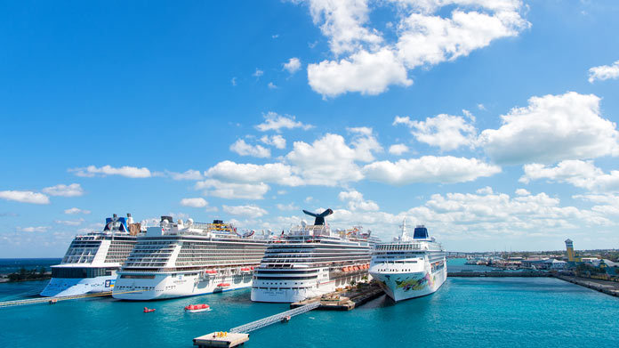 Cruise ships stationed on the coast of an ocean
