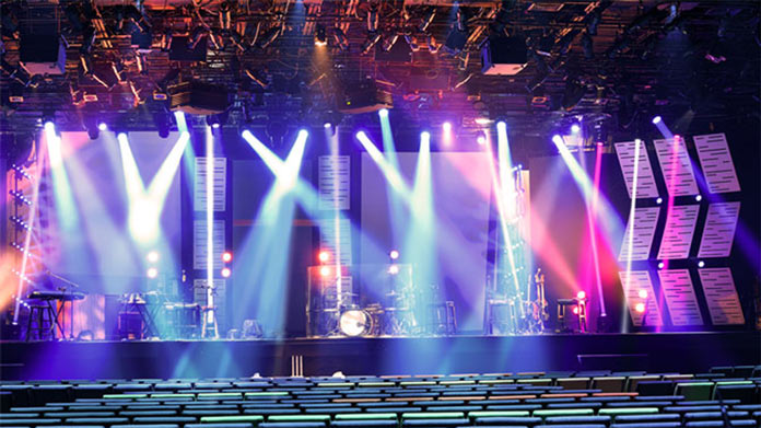 An auditorium with a stage set up for a concert