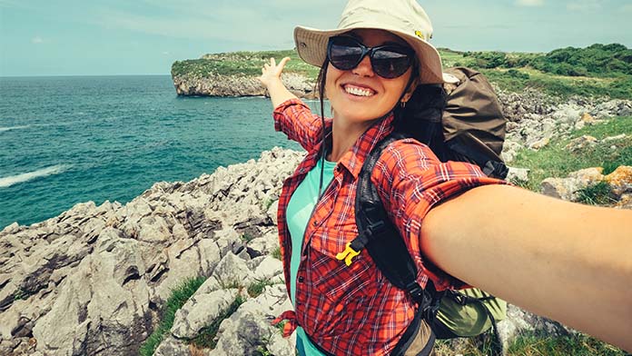 A woman taking a selfie while hiking