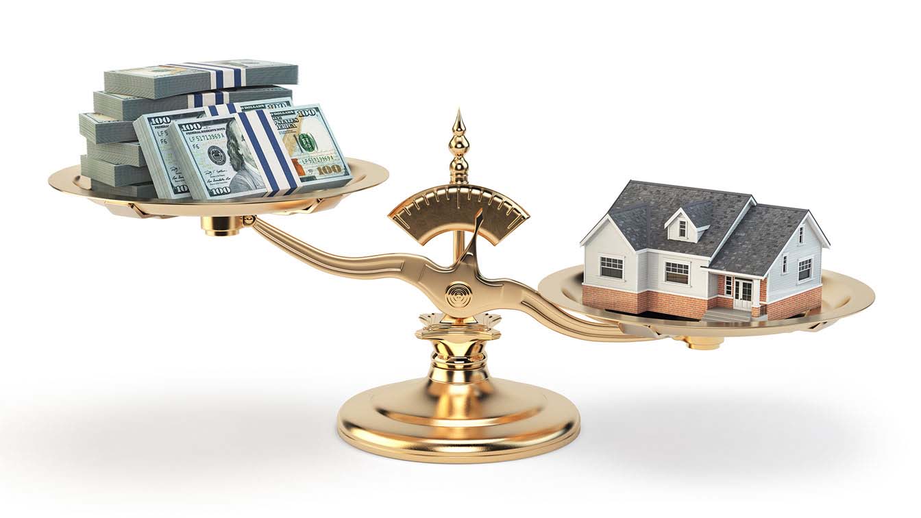 A scale balancing money and a house