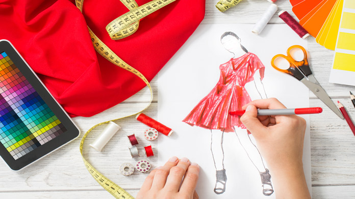 A person illustrating a woman in a red dress