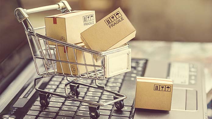 Shopping cart filled with cardboard boxes