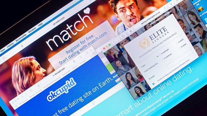 Multiple dating sites opened on a laptop screen