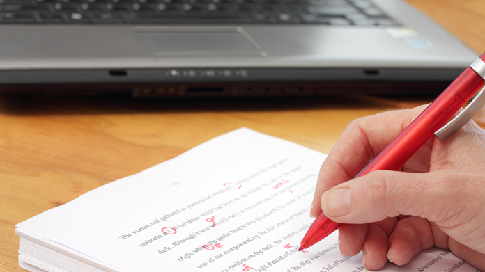 A sheet of paper being proofread