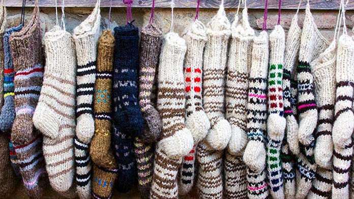 knitted socks hanging in a line