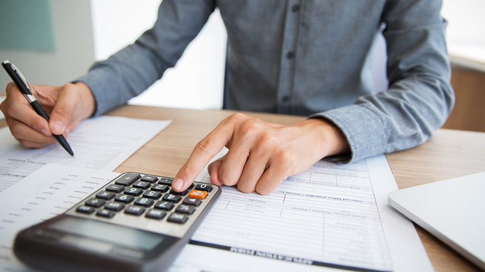 A person calculating taxes