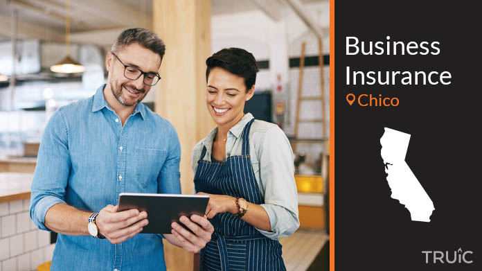 Two business owners looking at options for business insurance.