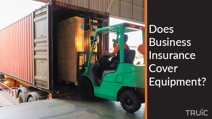 A person using a forklift to load a truck.