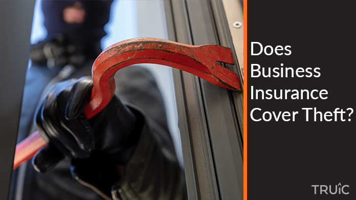 Someone using a crowbar to break into a building.