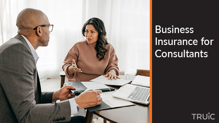 People consulting at a conference table.