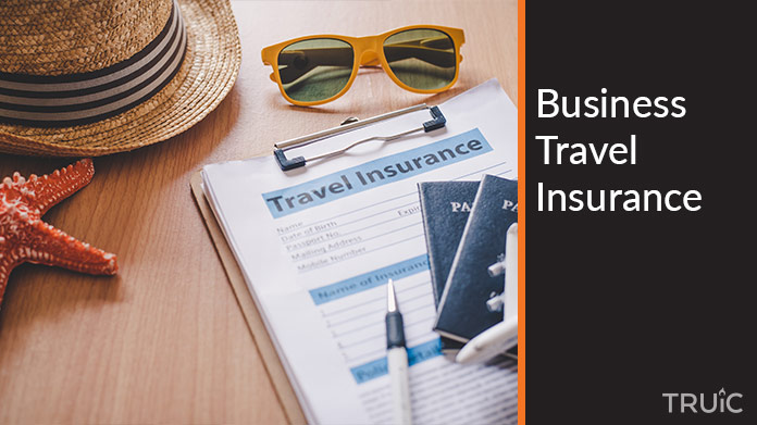 A clipboard with travel insurance on it.