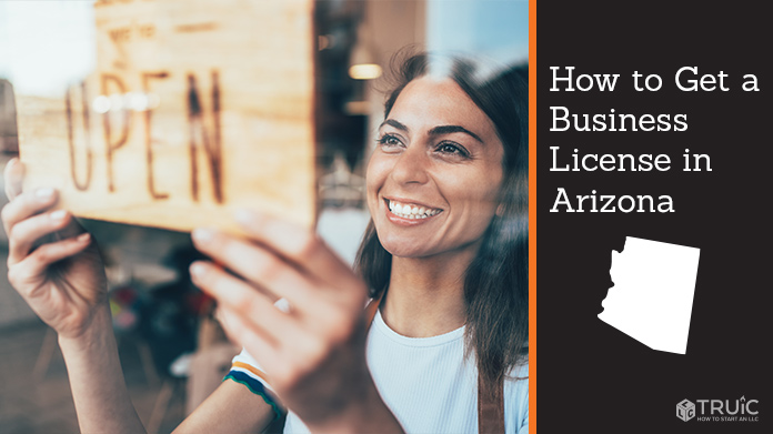 Woman holding open sign after getting her business license