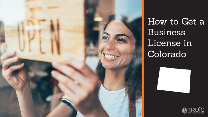 Woman holding open sign after getting her business license