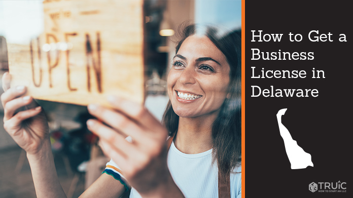 Woman holding open sign after getting her business license