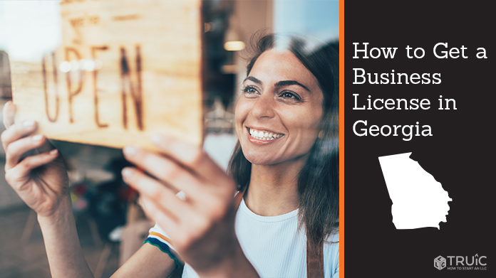 Woman holding open sign after getting her business license