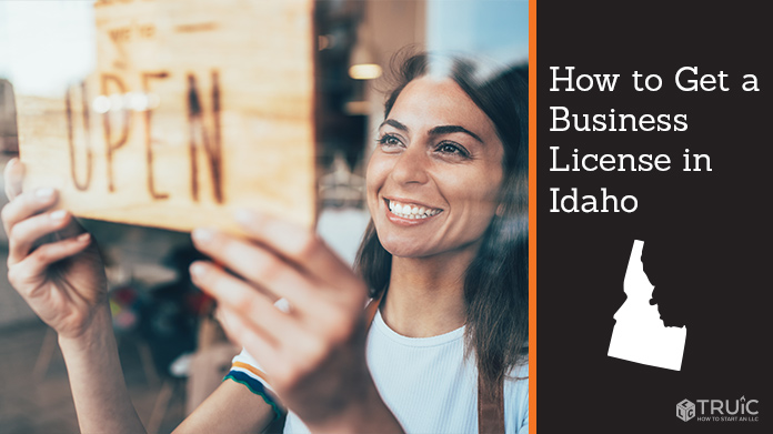 Woman holding open sign after getting her business license