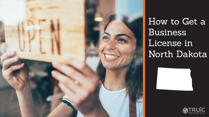 Woman holding open sign after getting her business license