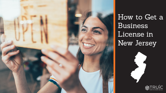 Woman holding open sign after getting her business license