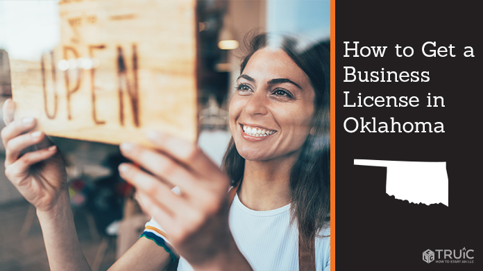 Woman holding open sign after getting her business license
