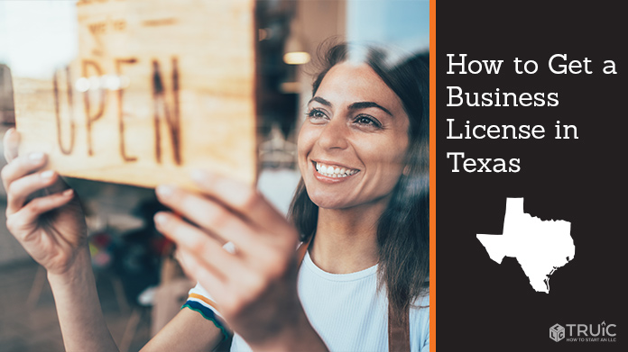 Woman holding open sign after getting her business license