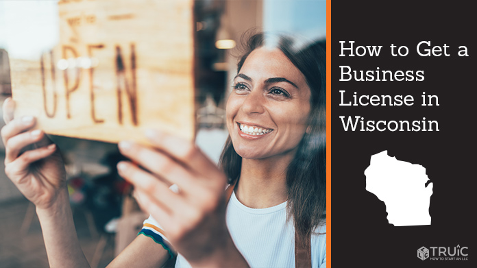 Woman holding open sign after getting her business license