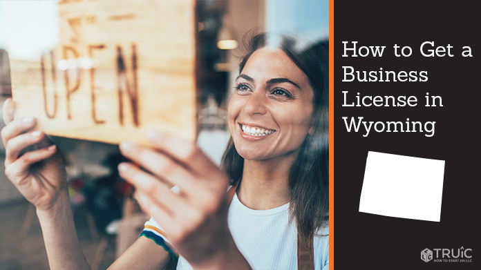 Woman holding open sign after getting her business license