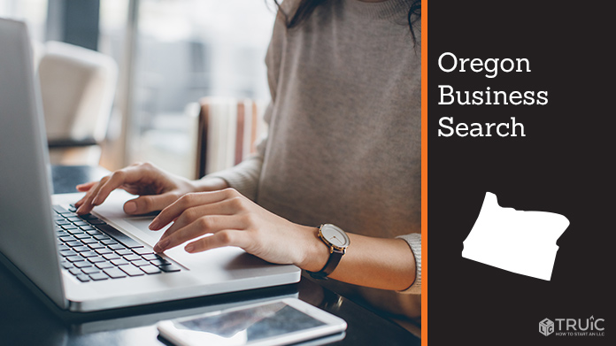 Person using computer to search for a business name.