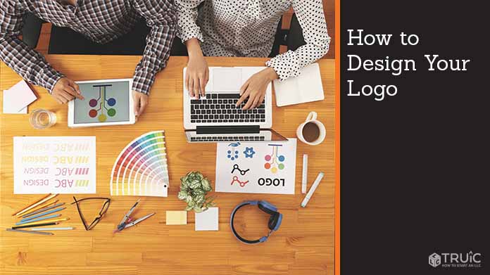 Two people brainstorming a logo design