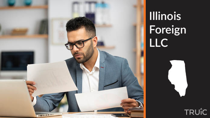 Man looking at paperwork to form his foreign LLC.