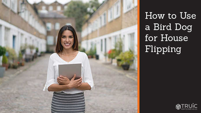 Real estate agent standing in front of a row of homes.