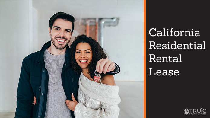 Couple standing with keys to their new rental.