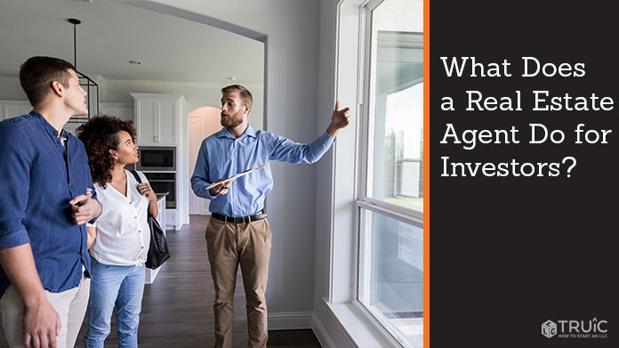 A real estate agent showing a home to prospective buyers.