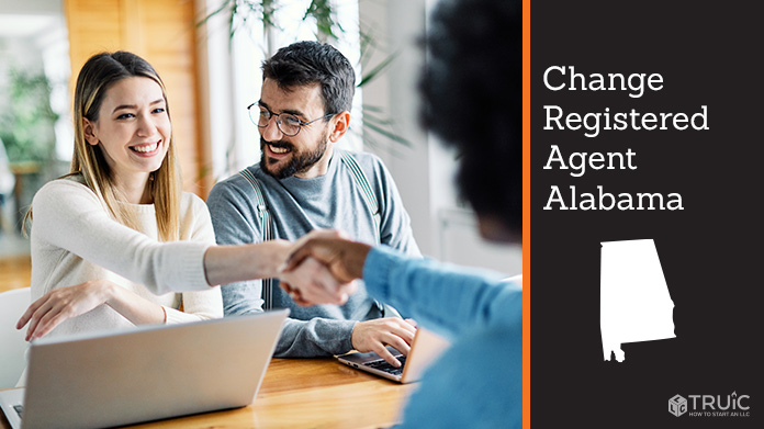 Couple meeting with registered agent, shaking hands.