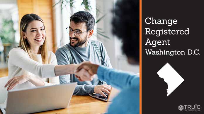 Couple meeting with registered agent, shaking hands.