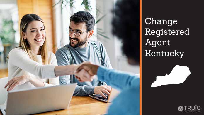 Couple meeting with registered agent, shaking hands.