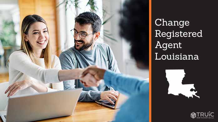 Couple meeting with registered agent, shaking hands.