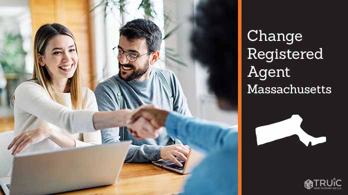 Couple meeting with registered agent, shaking hands.