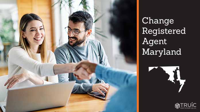 Couple meeting with registered agent, shaking hands.