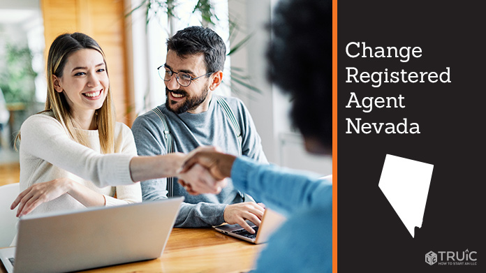 Couple meeting with registered agent, shaking hands.