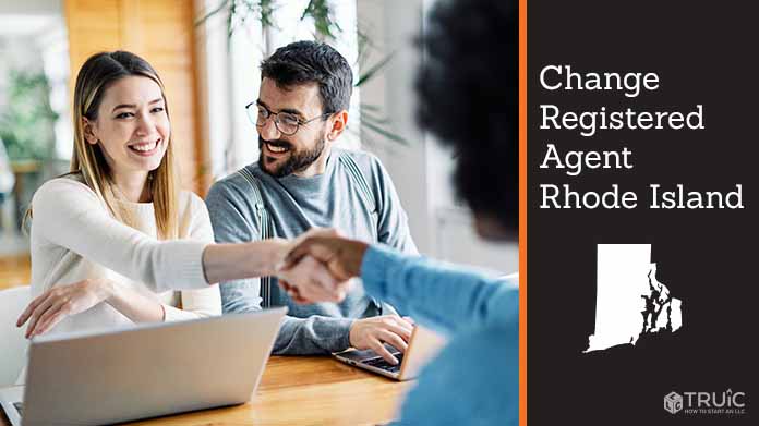 Couple meeting with registered agent, shaking hands.