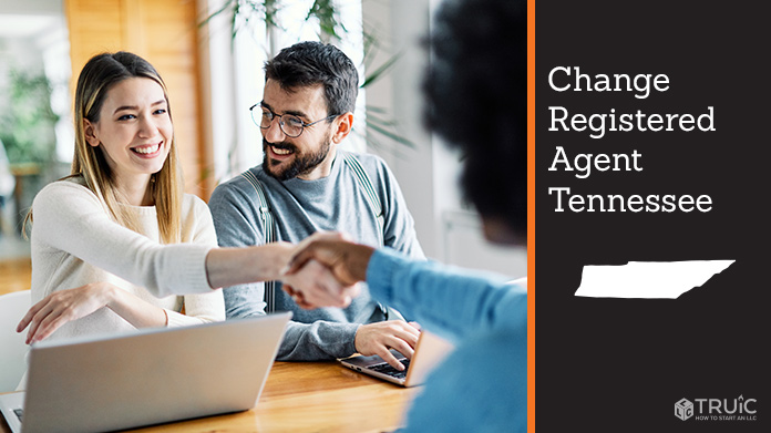 Couple meeting with registered agent, shaking hands.